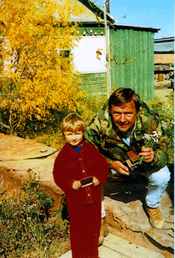 1991, Kamchatka, Russia. Picture for son of village chief and flowers for the
